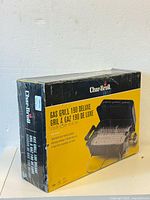 Front side of box showing Char-Broil branding and image of Gas Grill 190 Deluxe with packaging sealed.