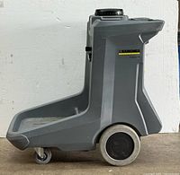 Side profile of the Karcher cleaning cart vacuum showing the molded grey plastic body, wheels, and handle.