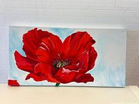 Front view of the handmade flower painting in vibrant red hues on canvas.