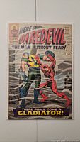 Full cover view of Daredevil #18 comic book featuring Gladiator and Daredevil fighting.