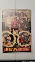 Front cover of Fantastic Four #56 comic book showing main characters and title with Klaw featured.