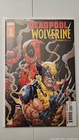 Front cover photo of Deadpool Wolverine #1 comic book, showing prominent illustration of Deadpool and Wolverine with clear print and no defects.