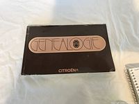 Front cover of the black Citroën Genealogie book showing title and logo