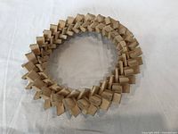 Top view of the interlocked wooden yeast ring with zigzag segments.