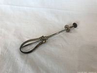 Full view of the silver plated ice/sugar tongs showing the overall form and design of the item on a white background.