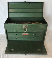 Green metal SK Wayne toolbox front view with top lid open showing drawers and tools inside