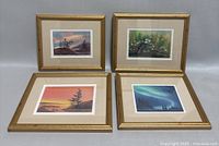 Four framed watercolor paintings on a white background. Frames are gold-toned with mats. Paintings depict landscapes and floral scenes.