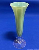 Front view of the full vase showing light green body and clear base