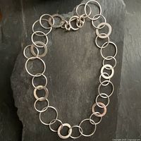 Full view of the sterling silver necklace showing the alternating large circle links.
