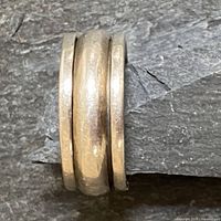 Top angle view showing the three-band design with the center band spinning mechanism visible.