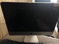 Front view of Apple iMac showing cracked display glass