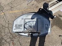Front of backboard showing Zone Attack graphics, NBA logo, rim and chain net