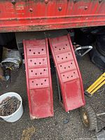 Overview of both red steel car ramps placed side by side