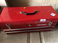Closed Craftsman red toolbox showing handle, latches, logo