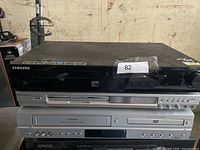 Front view of stacked Samsung, Magnavox and Citizen DVD players