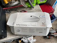 Boxed Apple AirPort Extreme Base Station top view with product image and 54 Mbps marking