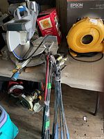 Bundle of assorted golf clubs showing shafts and heads
