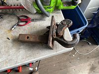 Side view of pintle hitch showing hook, latch, bolts and receiver shank