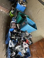 Multiple totes filled with hockey skates