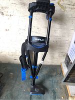 Full view of iWALK knee crutch showing knee platform, frame, and straps