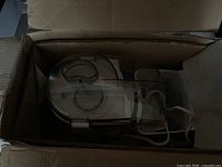 Juicer packed in box showing clear lid and housing