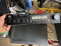 Front view showing controls, LED display and branding