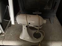 Top and side view of white KitchenAid stand mixer on table