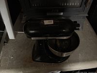 KitchenAid Classic black stand mixer with attached stainless bowl and whisk