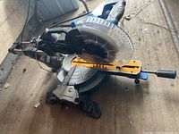 Overall view of Mastercraft sliding mitre saw showing blade guard, fence and handle