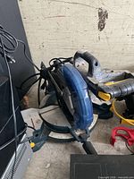Overall view of blue/grey Mastercraft 10-inch corded mitre saw
