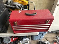 Front angled view of red Mastercraft tool chest showing drawers, handle, latches