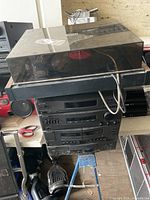 Stacked Sony hi-fi separates beneath Hinari turntable