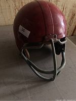Front view of red helmet with facemask