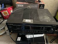 Front and top view of Pioneer receiver showing controls and ventilation grilles