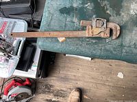 Full view of pipe wrench on table