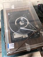 Overall view showing cracked dust cover and wood base turntable