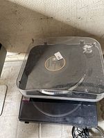 Top view showing iL turntable with clear lid stacked on second unit