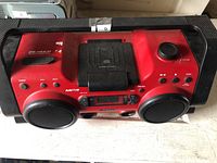 Front top view of Sony ZS-H10CP red/black portable boombox showing controls, speakers and carry handle