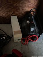 APC tower UPS and MotoMaster Eliminator booster pack with cables