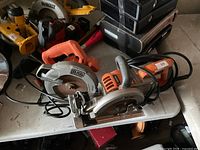 Both corded circular saws displayed on table