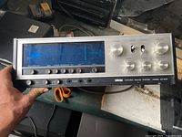 Front view of Yamaha CR-500 receiver showing illuminated blue dial and control layout