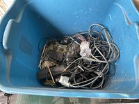 Blue tote with Xbox controllers, remote and cables