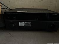 Front view of Yamaha RX-A2000 receiver showing missing knob