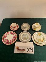 Overview of all three Royal Albert pattern sets displayed on table