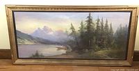 Front view of the large framed pastel landscape painting showing the entire artwork and gold painted wooden frame.