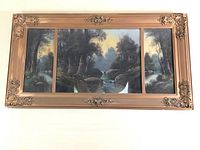 Full view of triptych painting within painted gold frame, showcasing the pastoral waterfall landscape.