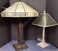 Two contemporary table lamps side by side, left is the larger slag glass lamp, right is the smaller metal lamp