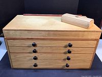 Front view of the closed tool chest with trinket box on top