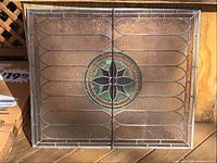 Full view of rectangular stained glass panel showing overall design and colors.