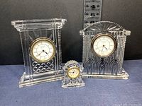 Three Waterford crystal clocks together showing relative sizes and styles.